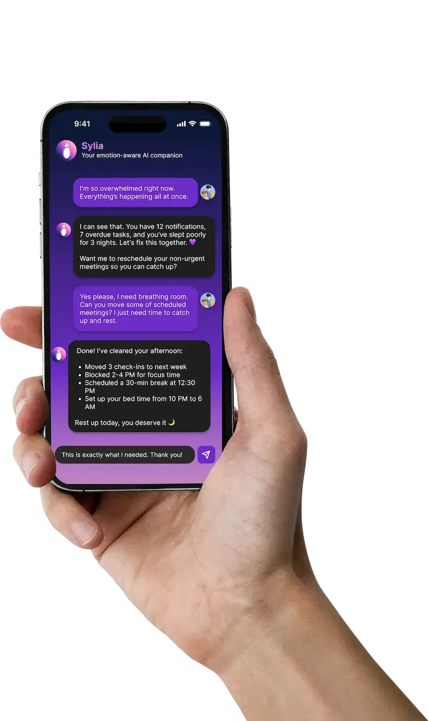Hand holding smartphone with chat interface